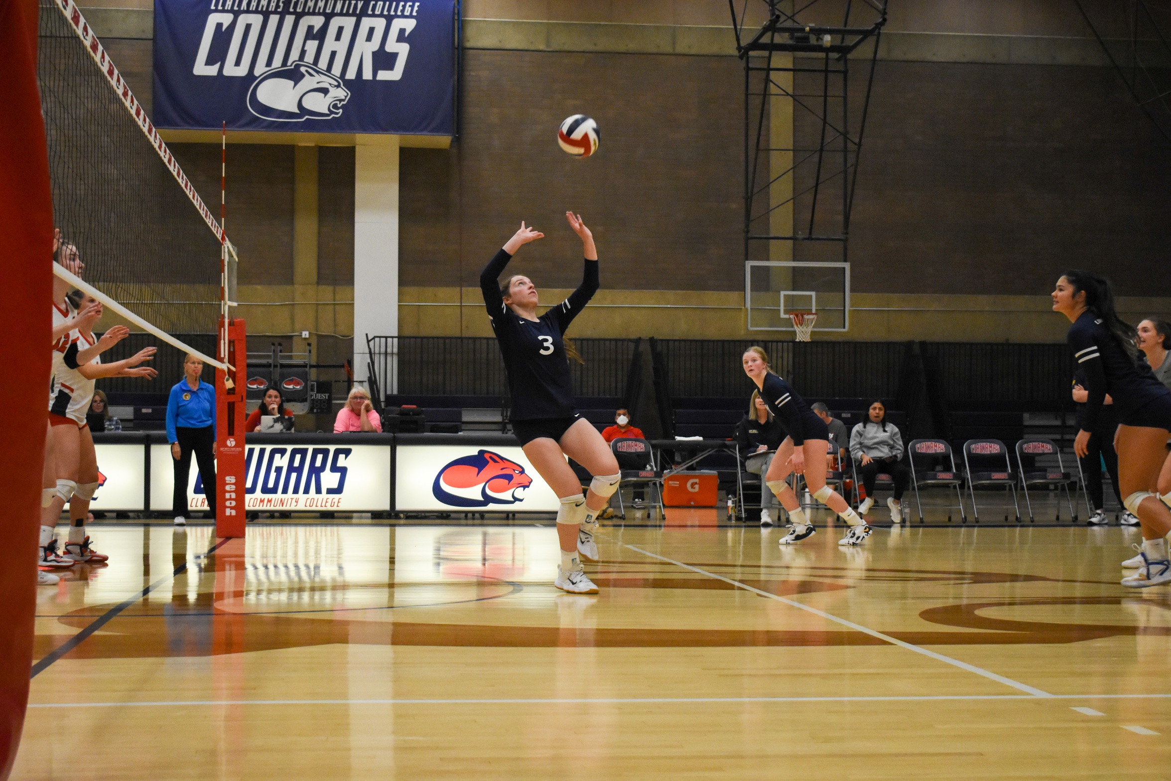 Savannah Hutchins sets the ball in a match against Clackamas Community College on Friday, Oct. 16.